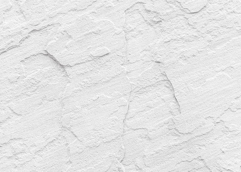 Protège-plaque à induction  - Mur blanc stuc